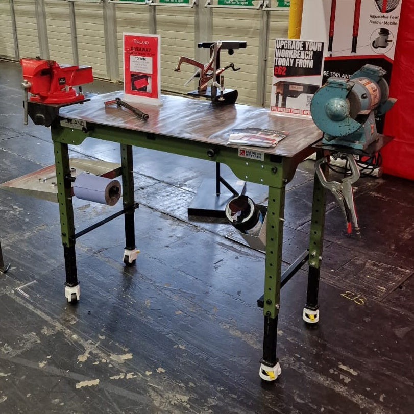 Workbench with tools and equipment in a workshop setting